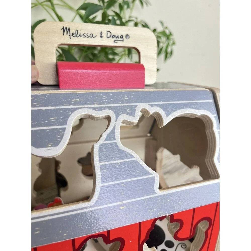 Melissa & Doug Wooden Take-Along Shape Sorting Barn with Flip-Up Roof 9 Figures